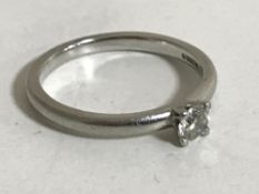A platinum and diamond ring,