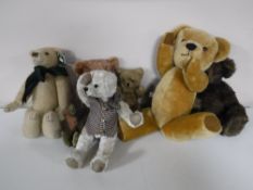 A box containing seven assorted teddy bears including Merry Thought, Hutton Bears,