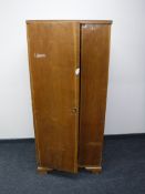 A mid 20th century single door hanging wardrobe