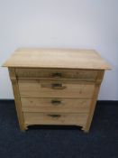 An antique pine four drawer chest