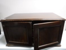 An antique mahogany three drawer cutlery chest containing small quantity of plated cutlery