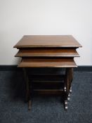 A nest of three mahogany tables