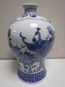 A Chinese blue and white vase, with bird decoration,