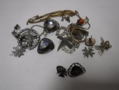 A collection of silver jewellery including brooches, pendants etc.