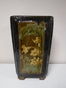 A Chinese earthenware glazed planter with panels depicting bamboo and birds, height 44 cm.