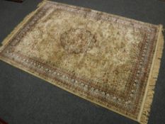 A machine made rug of Isfahan design,