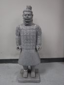 A garden figure of a terracotta soldier