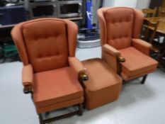 A pair of wood framed wingback armchairs,