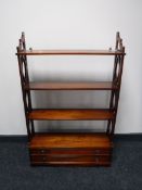 A set of mahogany open bookshelves,
