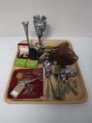 A tray of six penny red stamp album, cutlery, camera, Hohner band harmonica,