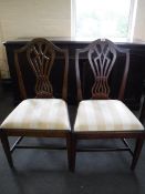 A pair of antique mahogany shield back dining chairs