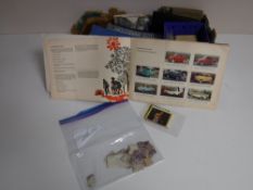 A box of assorted post cards, cigarette cards,