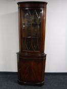 A mahogany corner display cabinet