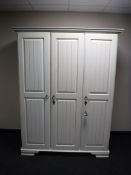 A white contemporary triple door wardrobe