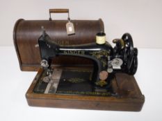 An oak cased vintage Singer sewing machine