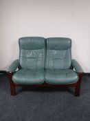 A five piece Ekornes green leather lounge suite, comprising of two seater settee,