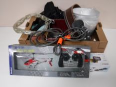 A box of weight lifting belts, bike chains, lap to bag, RC helicopter,