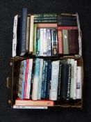 Two boxes containing reference books, annuals, novels,