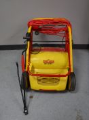 A Wolf electric lawn mower with lead