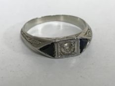 A platinum diamond and sapphire ring