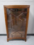 An antique mahogany display cabinet with astral glazed doors