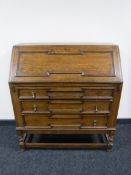 An early twentieth century oak writing bureau