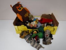 A box containing assorted vintage puppets, a vintage owl,