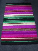 A contemporary machine made striped rug with silk pile