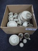 A box containing Denby dinner ware