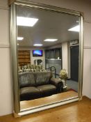 A silvered overmantel mirror,