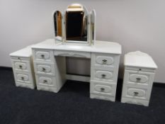 A contemporary seven drawer kneehole dressing table, with triple mirror and stool,
