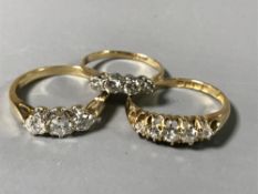Three 18ct gold diamond set rings - three stone, four stone and five stone.