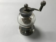 A silver and glass pepper mill CONDITION REPORT: The mechanism works.