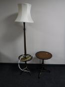 A mahogany standard lamp occasional table and a pedestal table
