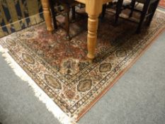 A Persian rug on pink ground,