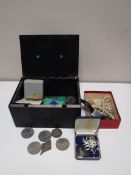 A cash tin, with key, containing crowns and other coins, costume jewellery,