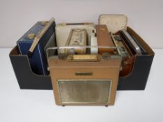 A box containing eight mid twentieth century radios