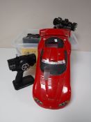 Three boxes containing Nitro Fuel remote controlled cars and handsets