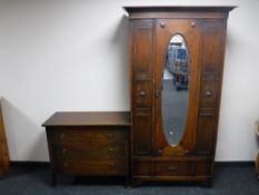 An early twentieth century oak mirror door robe,