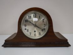 A mahogany cased mantle clock with silvered dial