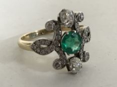 An 18ct gold emerald and diamond Art Nouveau style ring, size M/N.