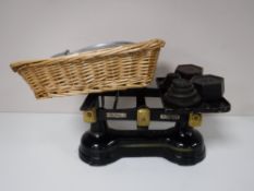 A set of grocers scales with weights and a griddle