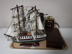 A tray of four wooden model ships on stands, cased binoculars,