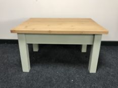A pine coffee table on painted legs