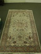 An Indian rug on ivory ground