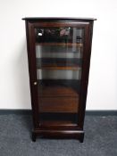 A Stag Minstrel audio cabinet in a mahogany finish