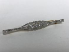 An 18ct gold diamond set bar brooch