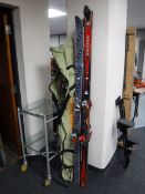 A set of Atomic skis in bag and a set of Salomon & Kneissl skis