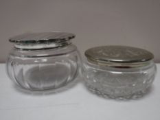A silver lidded glass dressing table pot,