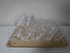 A tray of assorted lead crystal drinking glasses